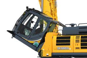 Pictured is a Kobelco SK550DLC demolition Excavators cab tilt, one of many impressive features in Kobelco Excavators.