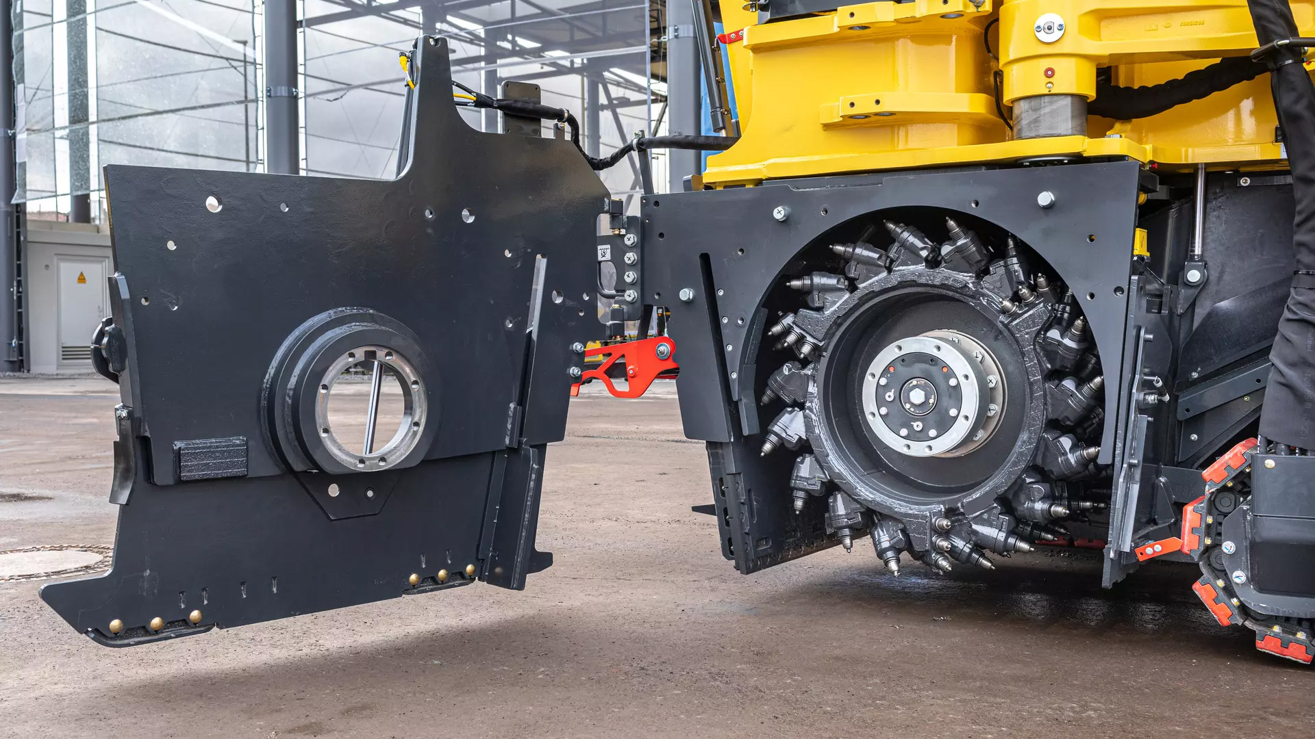Bomag BM 1200 Cold Planer side view, with part of machinery opened up and exposed