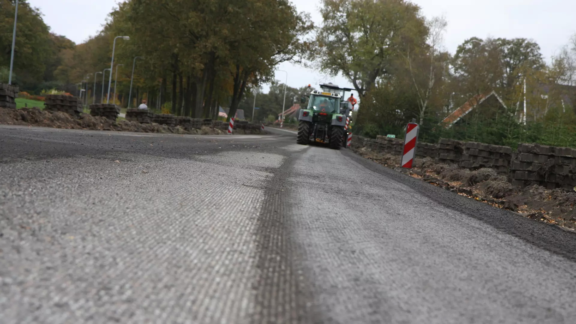 Bomag BM 2200 Milling Machine from a distance on a road that is being repaved