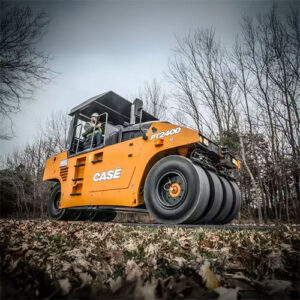 CASE PT240D Pneumatic Tire Roller on asphalt road surrounded by a forest