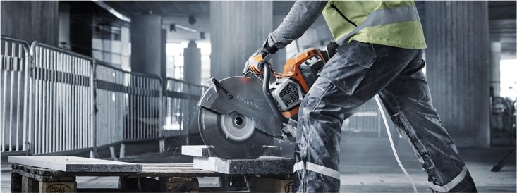 man using Husqvarna saw