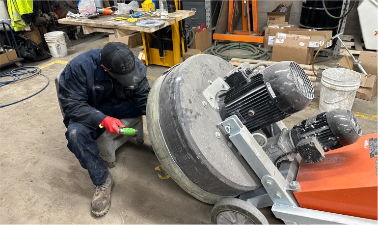 McCann technician servicing Husqvarna machine