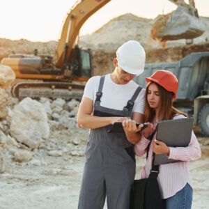 Two contractors look over construction plans/